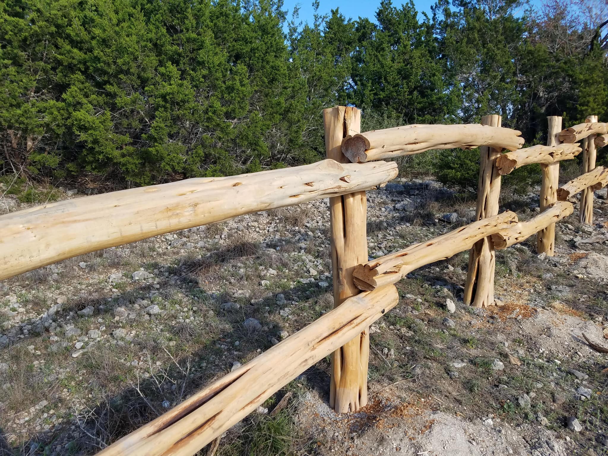Peeled cedar rail fence with stacked rails